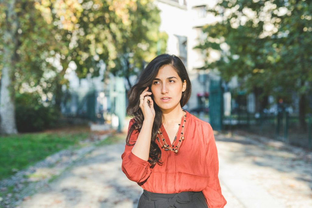 Woman outdoor talking smartphone