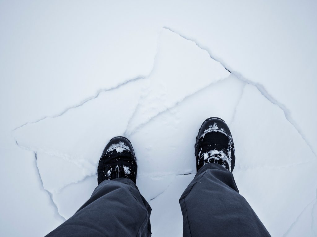 Man walking on broken ice