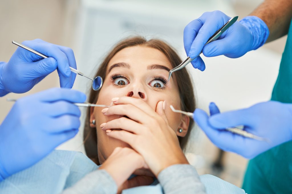 Male dentist and woman in dentist office