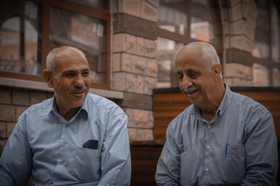Two friends talking face to face in a warm natural setting
