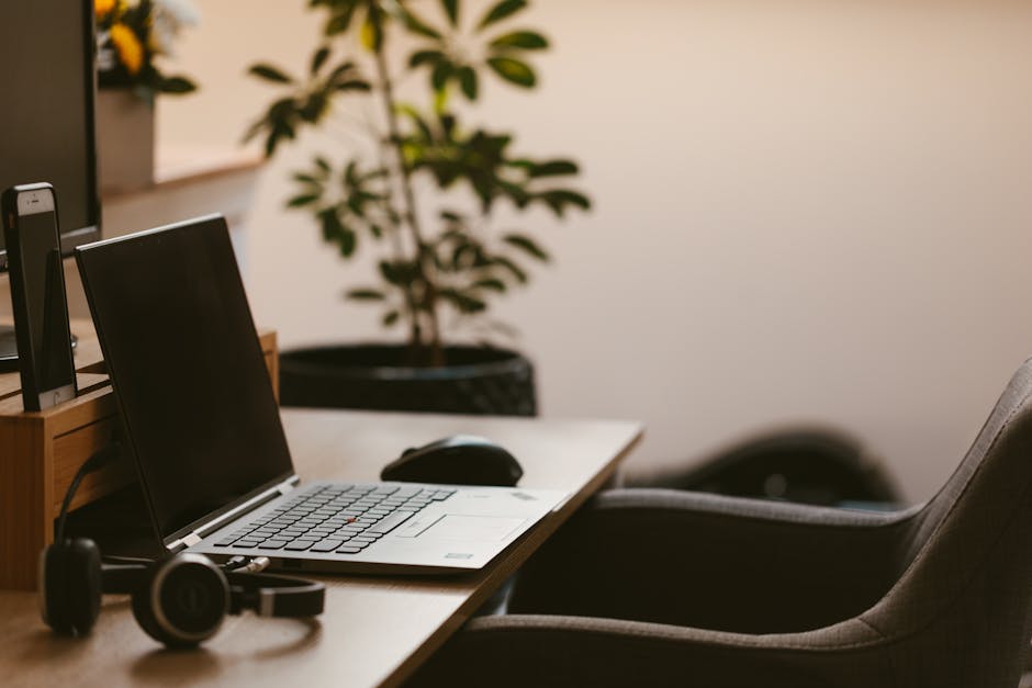 Person working from home on laptop in a bright home office