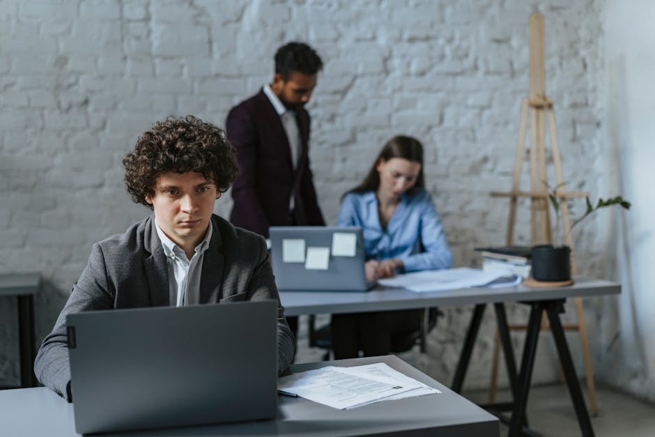 Professional community manager analyzing social media comments on a laptop