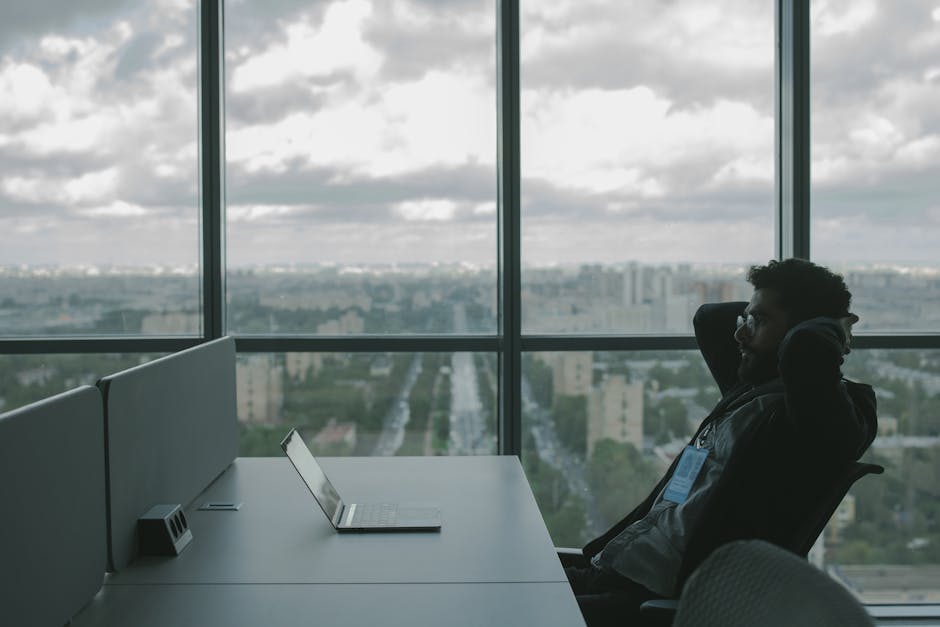 Stressed employee sitting alone after losing a job