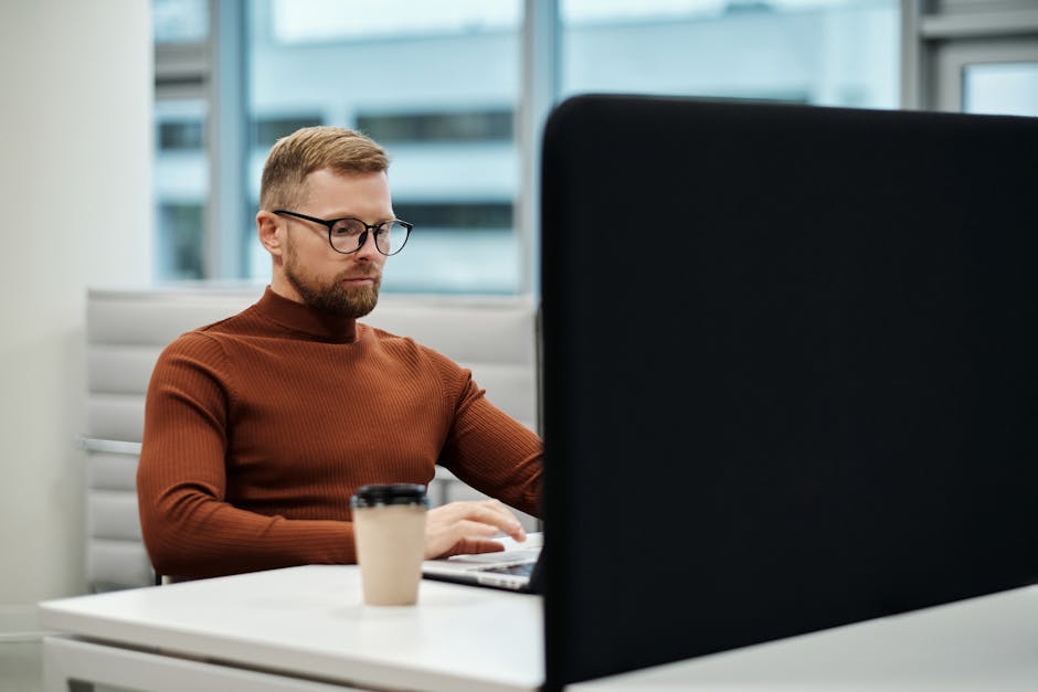 Quiet focused workspace with a person working at a desk