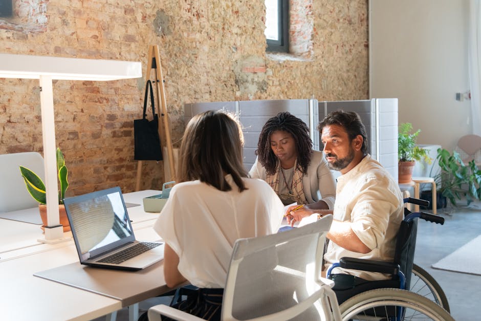 Manager leading an inclusive team discussion in a modern office
