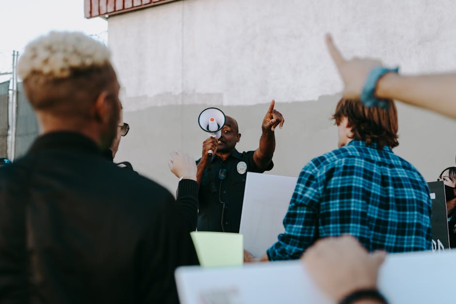 Person speaking into a megaphone in a workplace protest