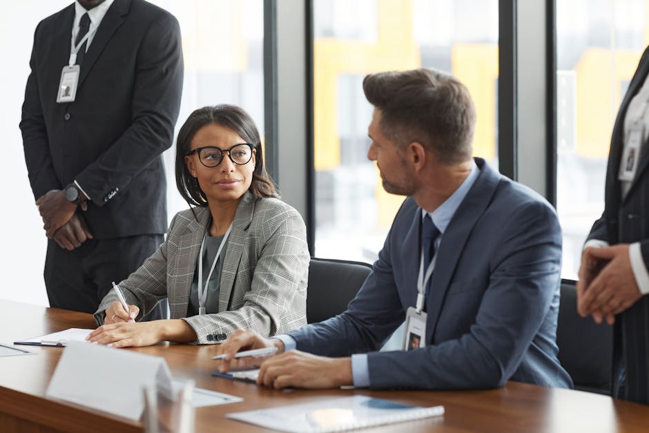 Business meeting with professionals in formal attire around a conference table