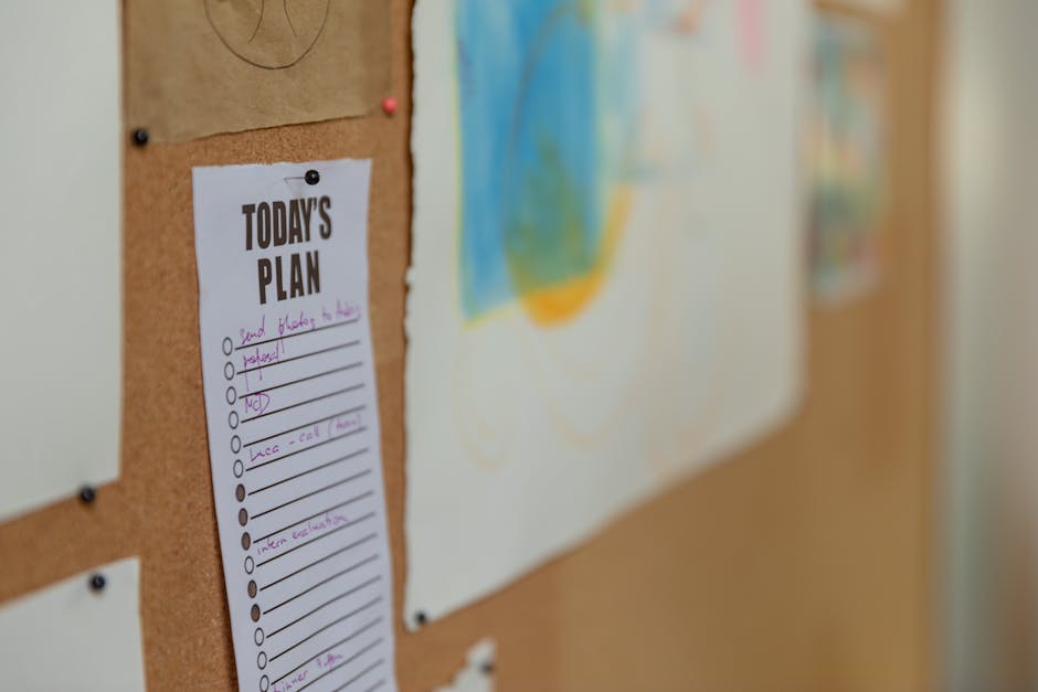 Person organizing tasks on a priority matrix board in a modern office