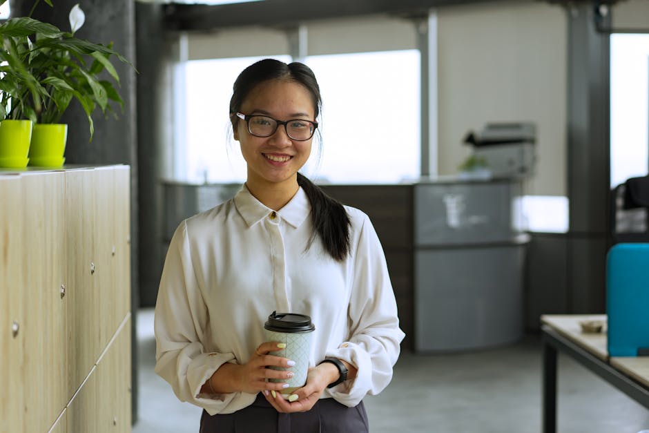 Employees leaving office after a short morning presence with coffee cups