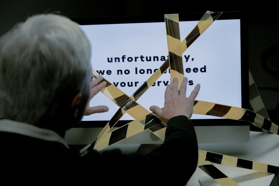 Stressed office worker reacting to an angry message on a screen